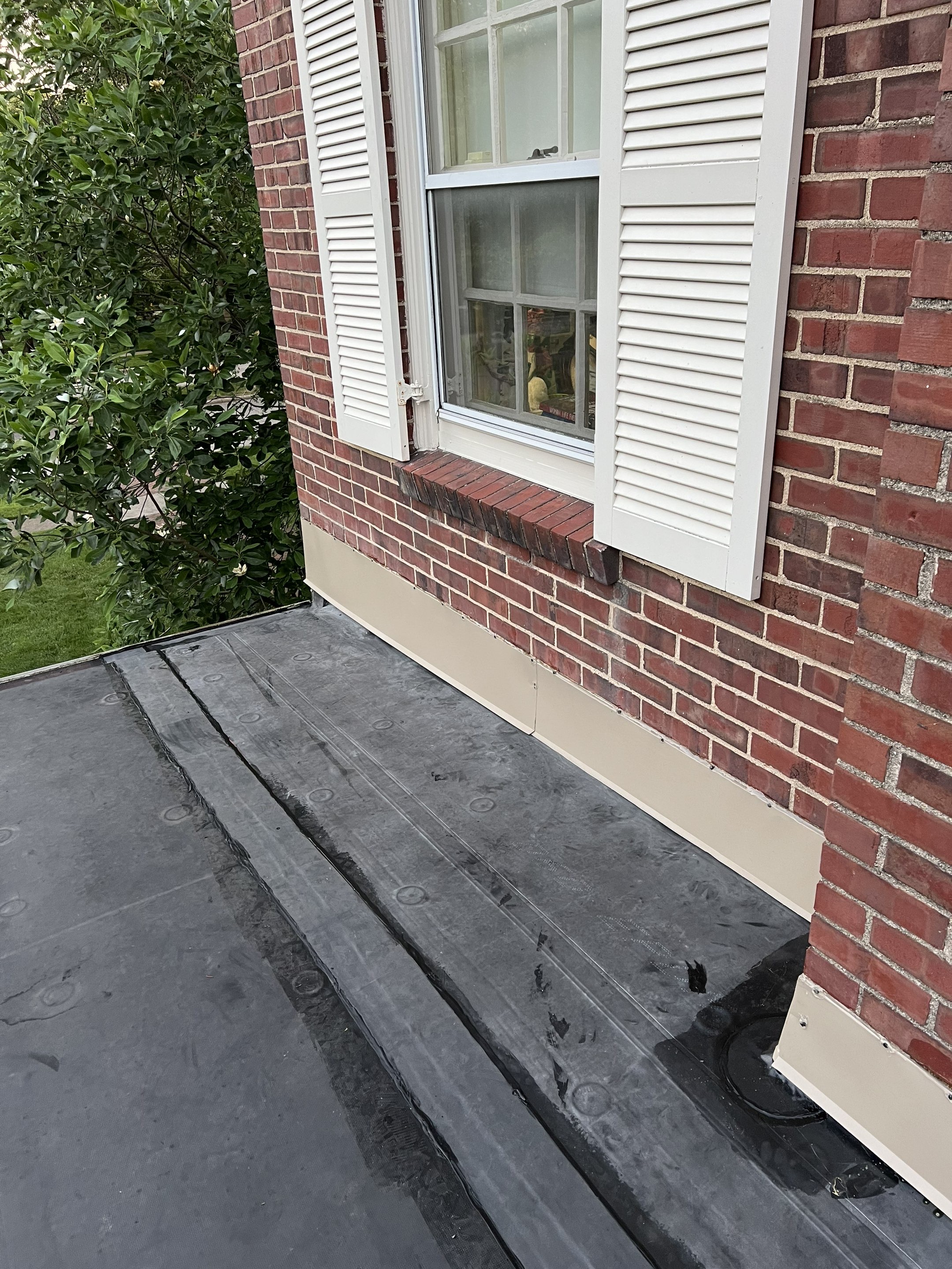 Residential Roofing Installation using 60 mil rubber roof 